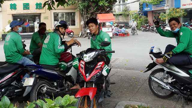 A group of GrabBike drivers in Tan Binh District, Ho Chi Minh City. Photo: Tuoi Tre