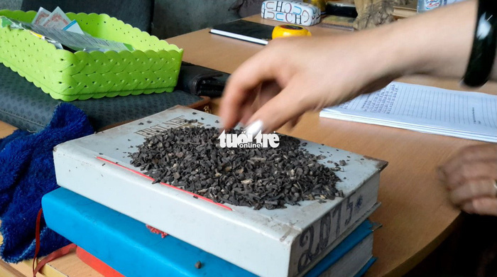 Ground coffee beans are mixed with dirt and rock dust and dyed in manganese dioxide taken from used batteries to produce dirty coffee at a facility in Dak Nong Province in the Central Highlands region of Vietnam. Photo: Tuoi Tre