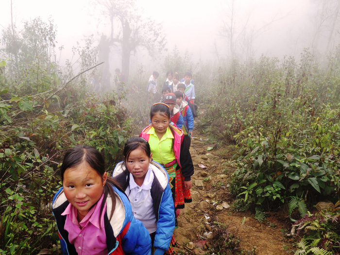 Students walk along a dirt road in the mountains of Son La Province, northern Vietnam. Photo: Tuoi Tre