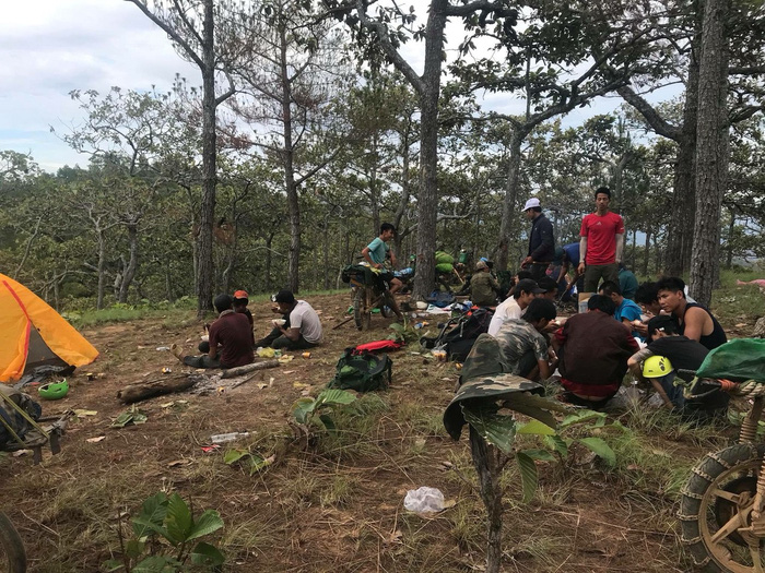 Volunteers take a rest in a forest in Binh Thuan, south-central Vietnam, in this supplied photo.