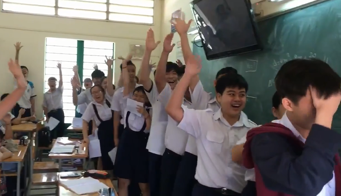 The students looksexcited, all holding their exam sheets as proof of their achievement  in this photo captured from the uploaded video.