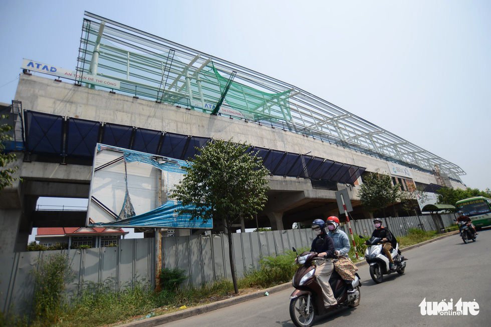 A billboard providing information on Ho Chi Minh City’s metro project is badly damaged after years in the weather. Photo: Tuoi Tre