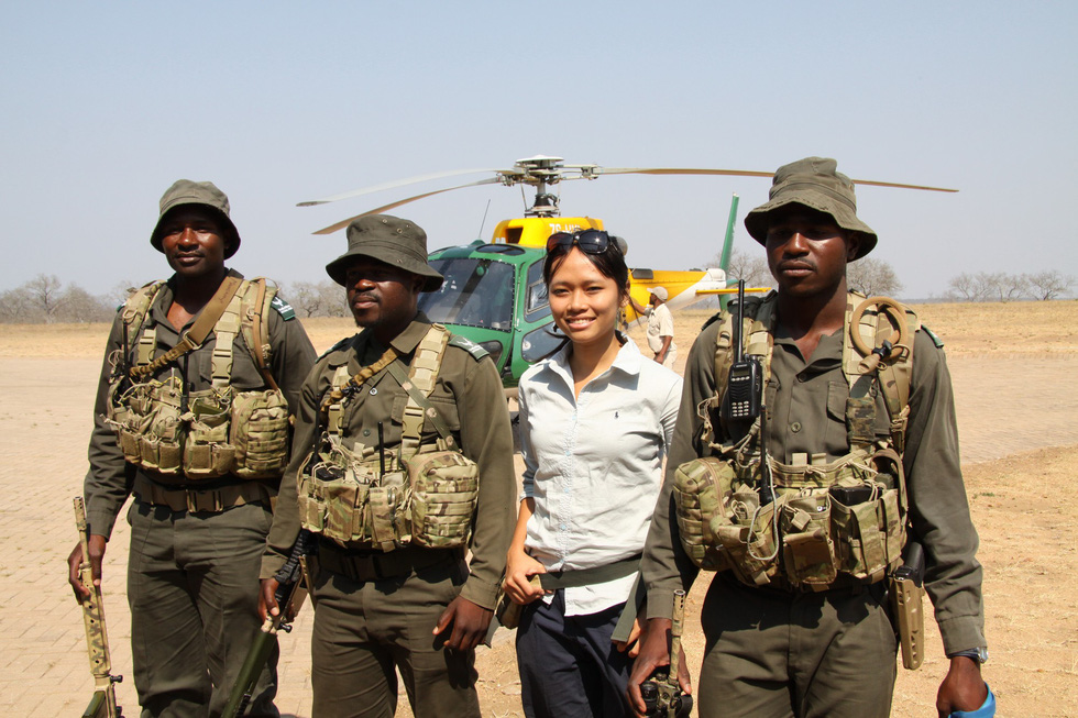 Trang poses with rangers at the Kruger National Park in South Africa in this supplied photo.