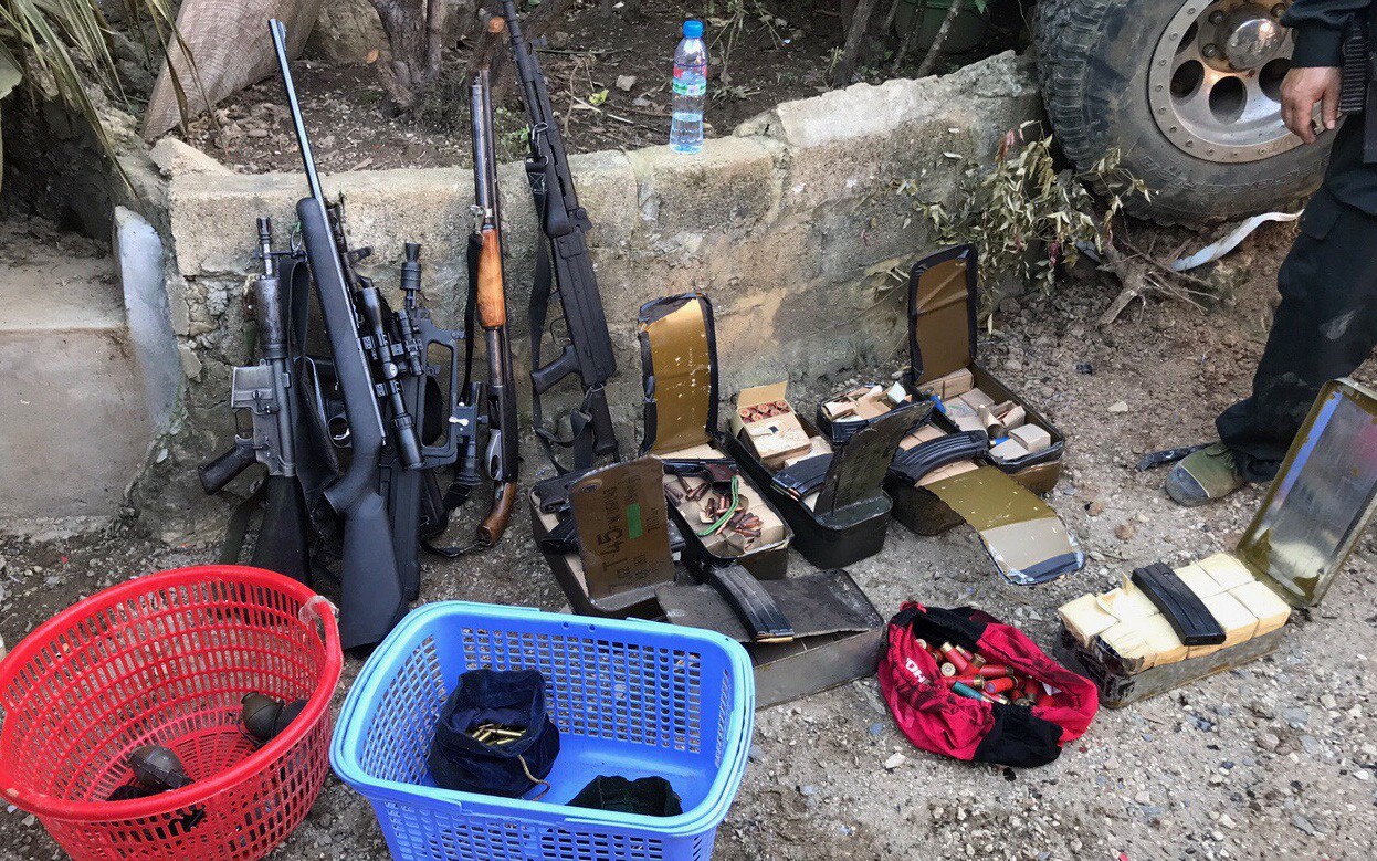 Firearms and ammunitions are found inside the fortified bunkers of a drug ring in Son La Province in northern Vietnam. Photo: Tuoi Tre