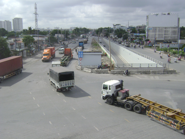 Articulated trucks drive at the My Thuy Intersection as viewed from the My Thuy Overpass in in Ho Chi Minh City, Vietnam. Photo: Tuoi Tre