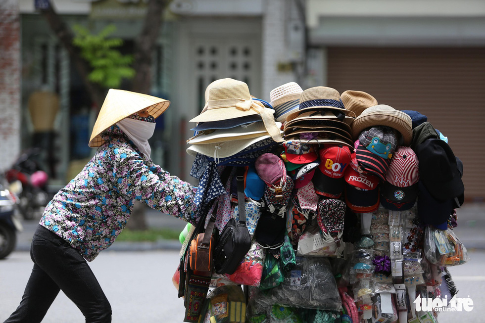 A vendor on Ba Trieu Street in Hanoi.