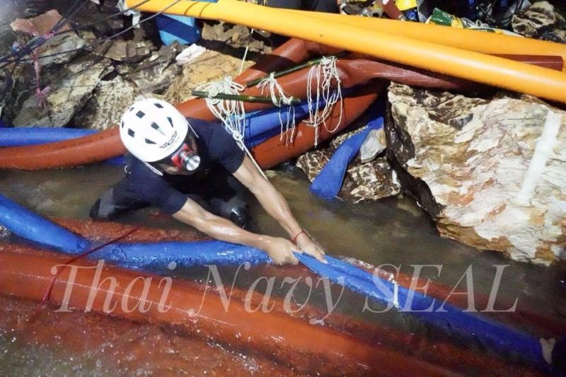 Rescue personnel work at the Tham Luang cave complex, as members of an under-16 soccer team and their coach have been found alive according to local media, in the northern province of Chiang Rai, Thailand July 4, 2018. Thai Navy Seal/Handout via REUTERS