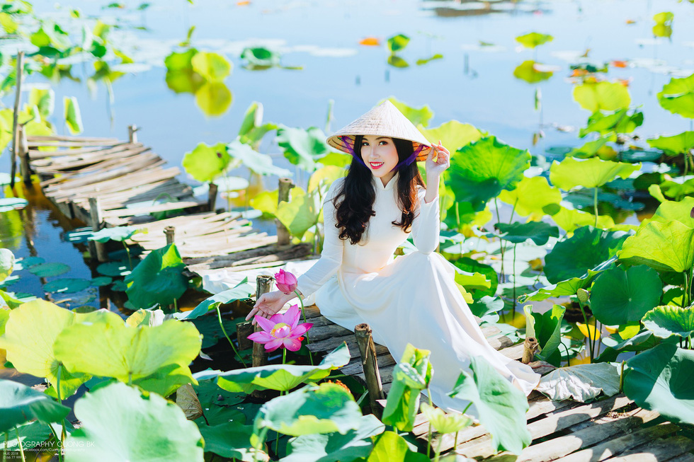 Palm-leaf conical hats and Ao Dai make up the traditional Vietnamese costume