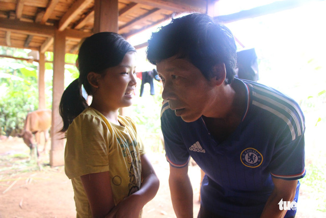 Khieu sits near her partially deaf father to make communication easier.