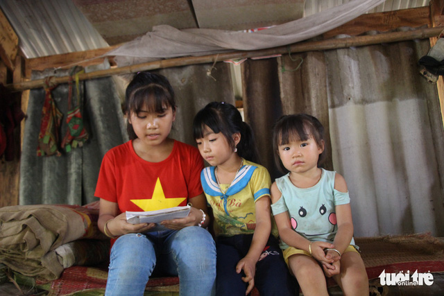 Nhan tutors other village children in literature and math.