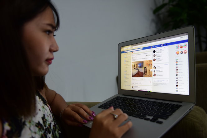 A woman browses Facebook in this photo taken in Ho Chi Minh City. Photo: Tuoi Tre