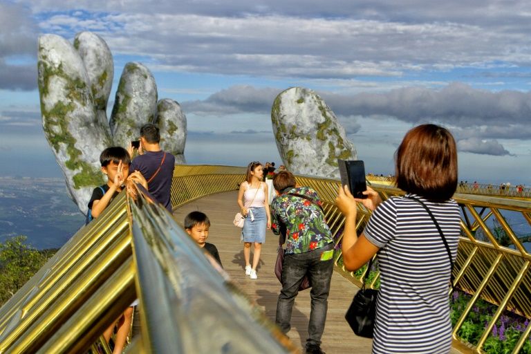 Visitors take pictures on Golden Bridge in Da Nang, Vietnam. Photo: AFP