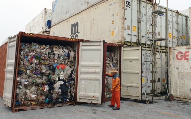 Rubbish is found inside two containers at a port in Hai Phong City. Photo: Tuoi Tre