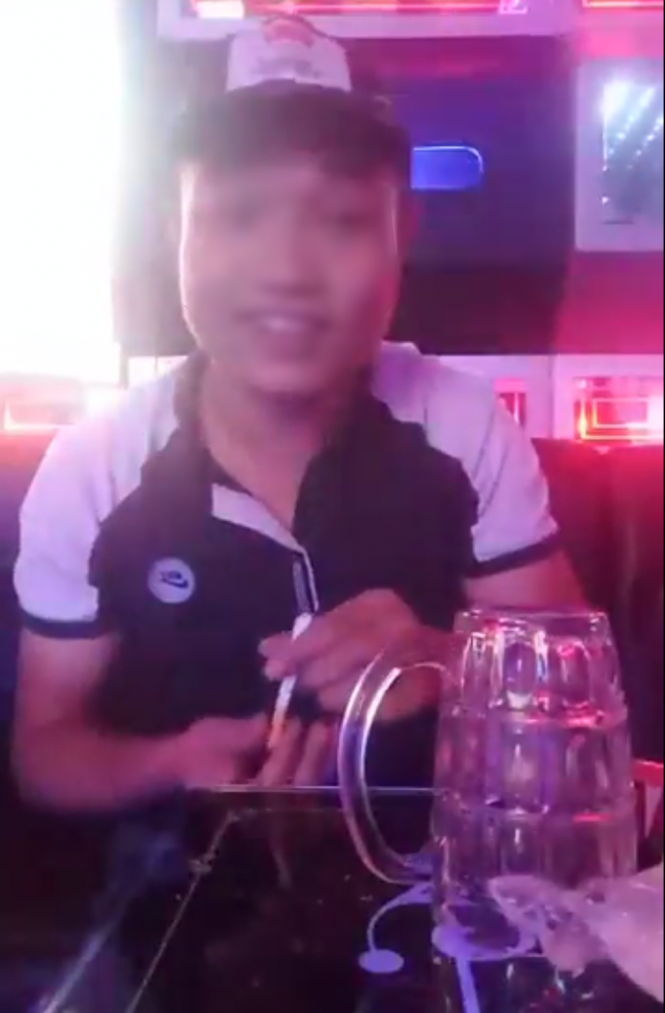A cannabis user demonstrates how to smoke the drug at a karaoke bar in Vietnam. Photo: Tuoi Tre