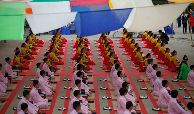 Participants wearing traditional Korean Hanbok costumes attend a traditional coming-of-age day ceremony at Namsangol Hanok Village in Seoul May 20, 2013.