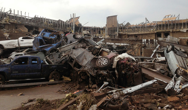 Overturned cars are seen after a huge tornado touched down in the town of Moore, near Oklahoma City, Oklahoma May 20, 2013.