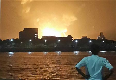 Hope fades for 18 on submarine after blasts, fire