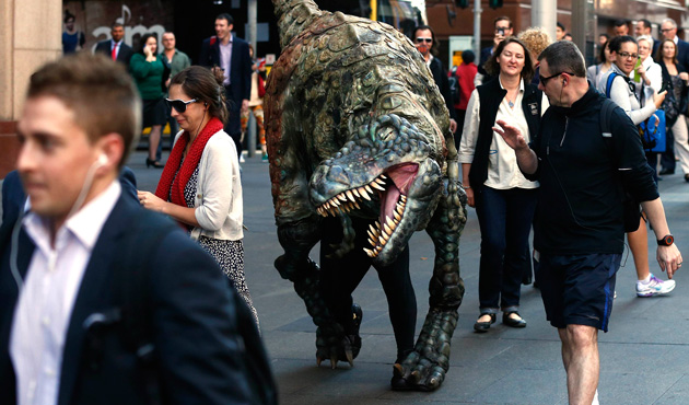 Walking with dinosaur costume in pics