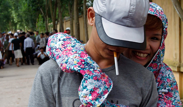 A former inmate (L) is greeted by his relative after he is released from Hoang Tien prison, about 100 km (62 miles) outside Hanoi August 30, 2013. 