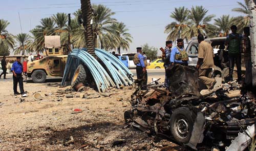 Two roadside bombs outside Iraq mosque kill 30