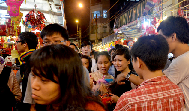 Large crowds of local Vietnamese gather on Lantern Street.