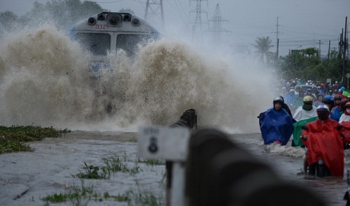 Downpours, high tides lash HCMC