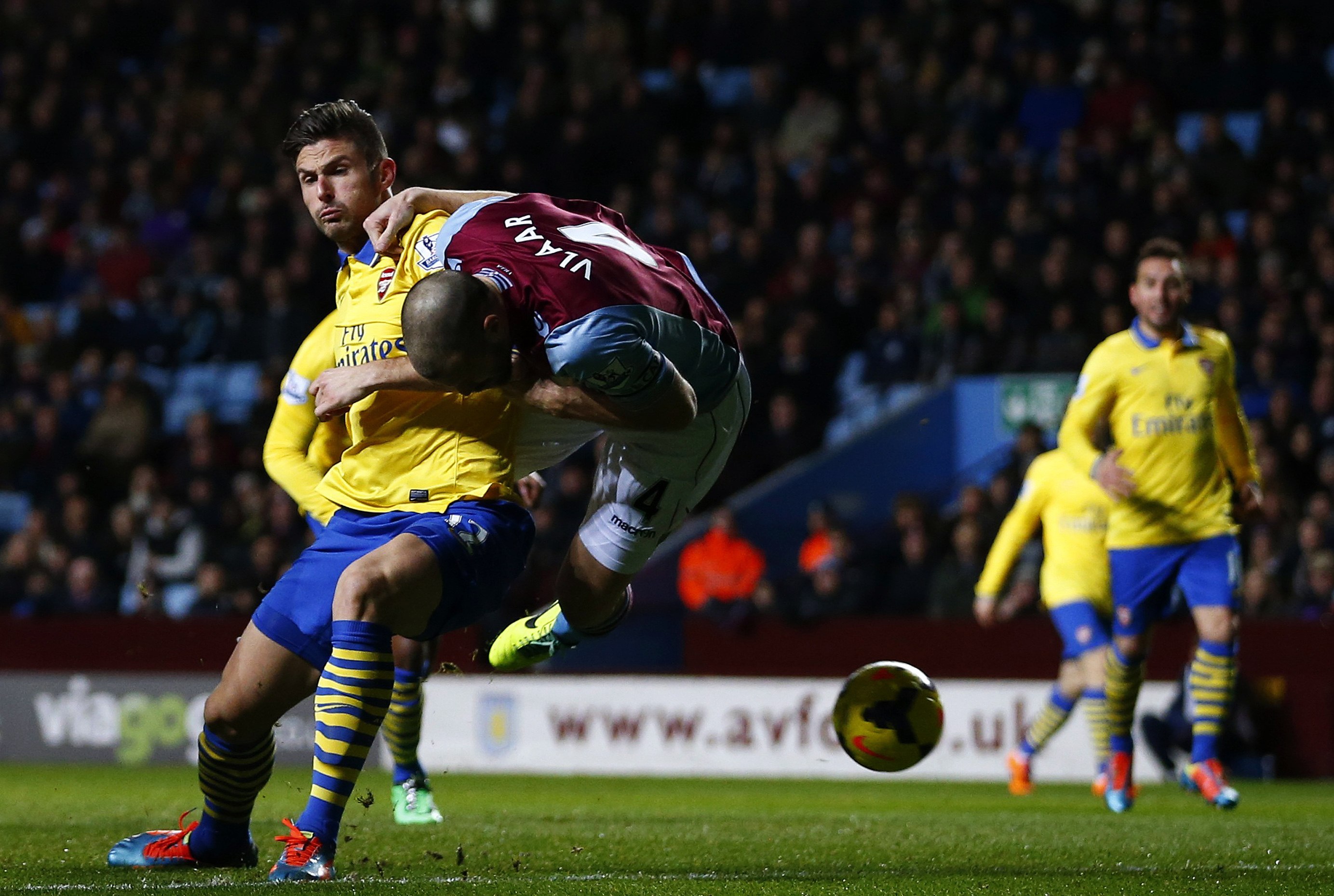 Arsenal survive late scare at Villa to go top