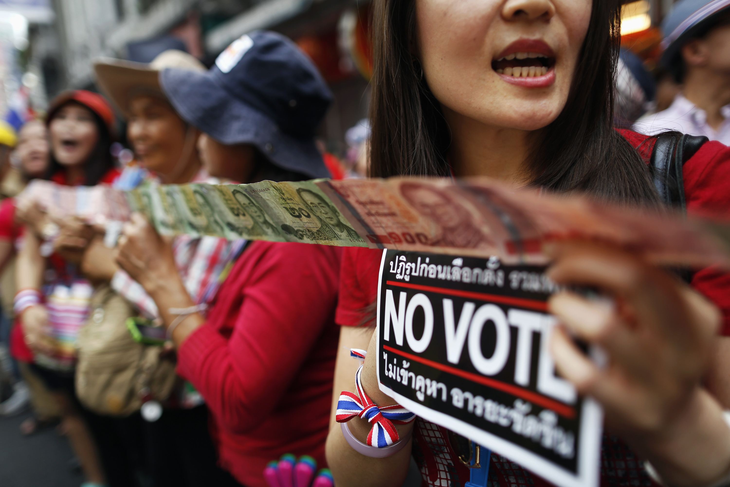 Thai protesters march as poll official says some ballot deliveries blocked