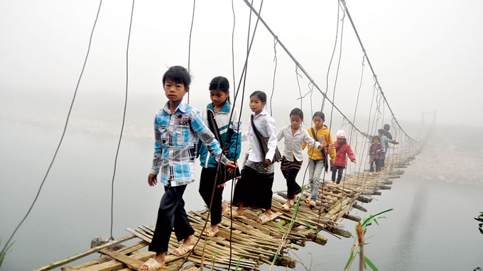 Villagers cross bridges in fear of collapses