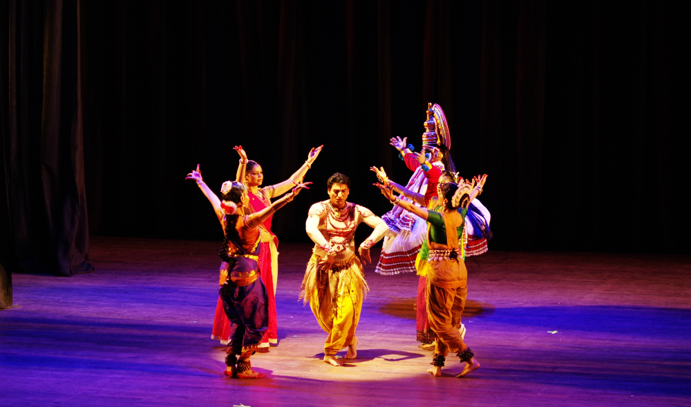 Six Indian dancers prepare for a new dance at the show.
