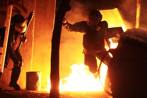 Riot police, protesters clash in Venezuela