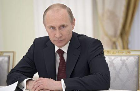 Putin calls on Ukraine rebels to put off secession vote