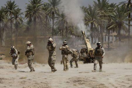 As caliphate declared, Iraqi troops battle for Tikrit