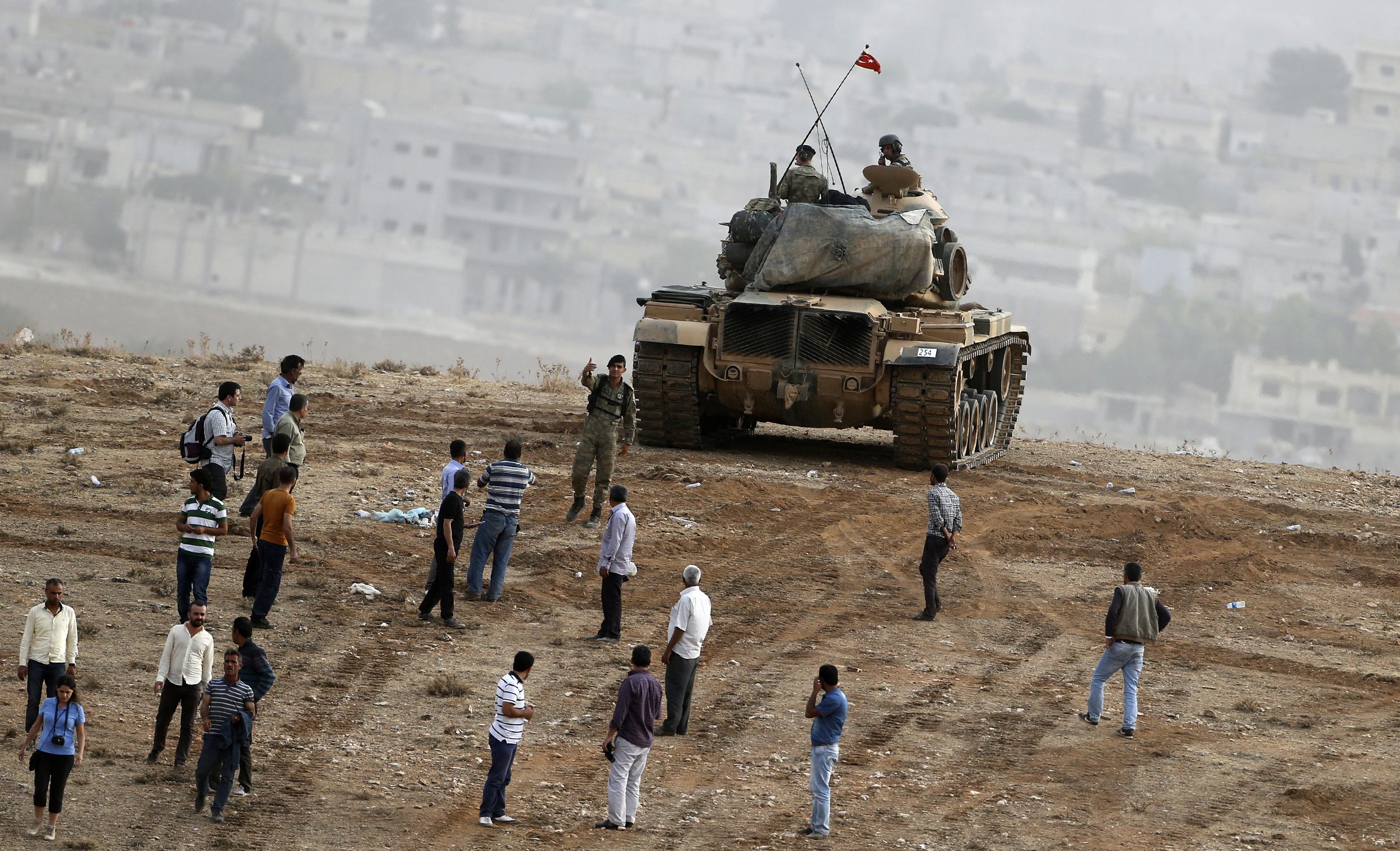 Kurds hold off Islamic State in Kobani; fighters strike in Iraq
