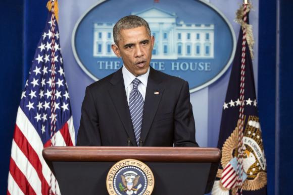 Obama urges people of Ferguson to react peacefully