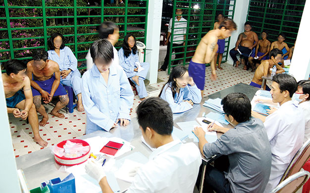 In photos: sending drug addicts to compulsory rehab in HCMC
