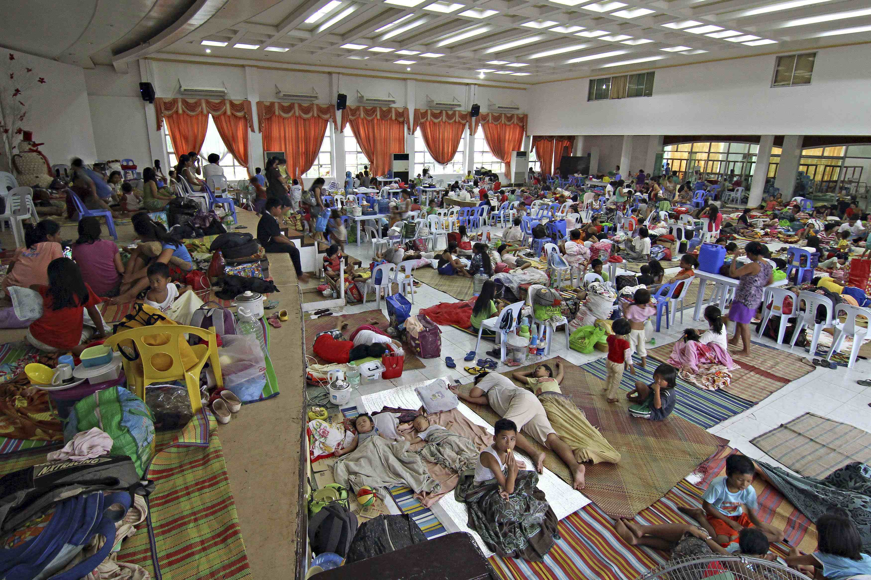 Relief in Philippines as typhoon crawls west; 4 dead