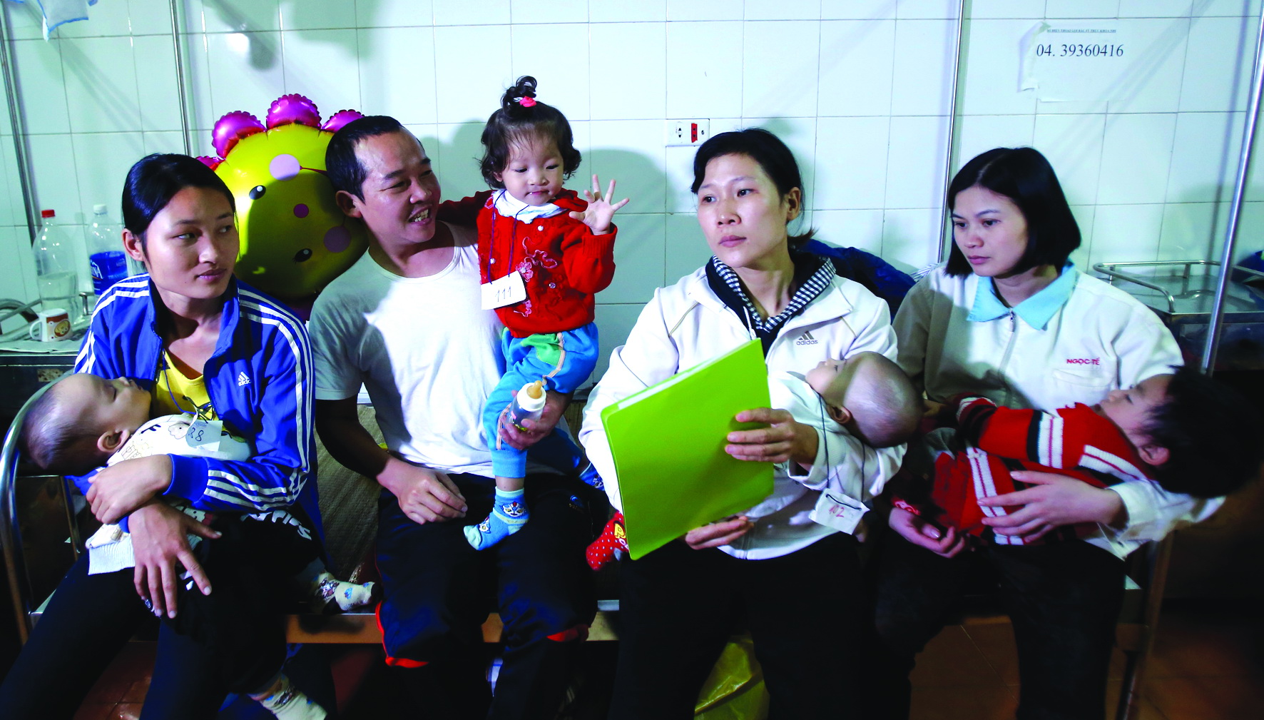 Nguyen Thi Hanh (the 2nd baby from right) was born to a father who has a cleft lip. She is among the children who have their lips remedied by Operation Smile.