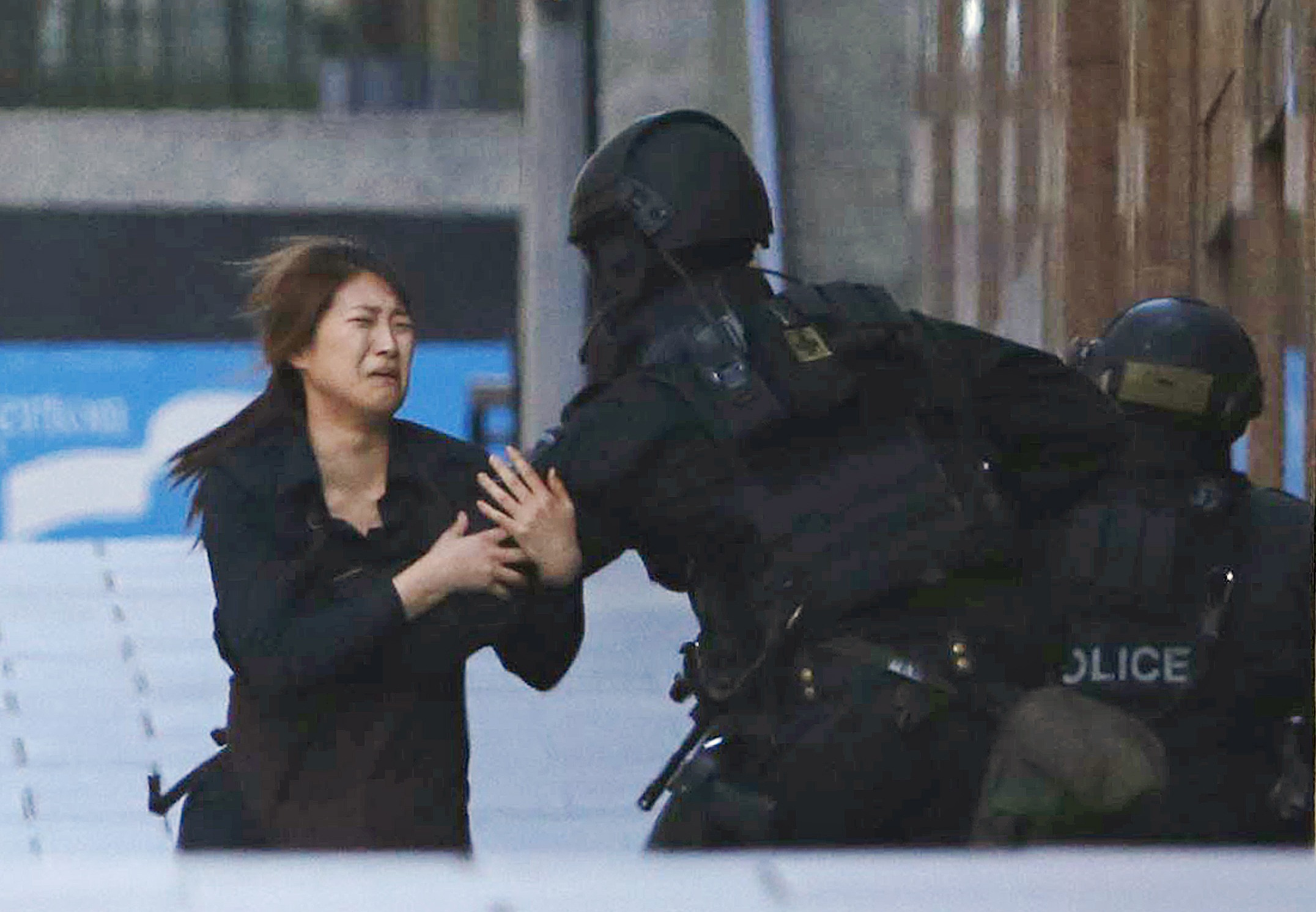 Two more hostages run out of Sydney siege cafe