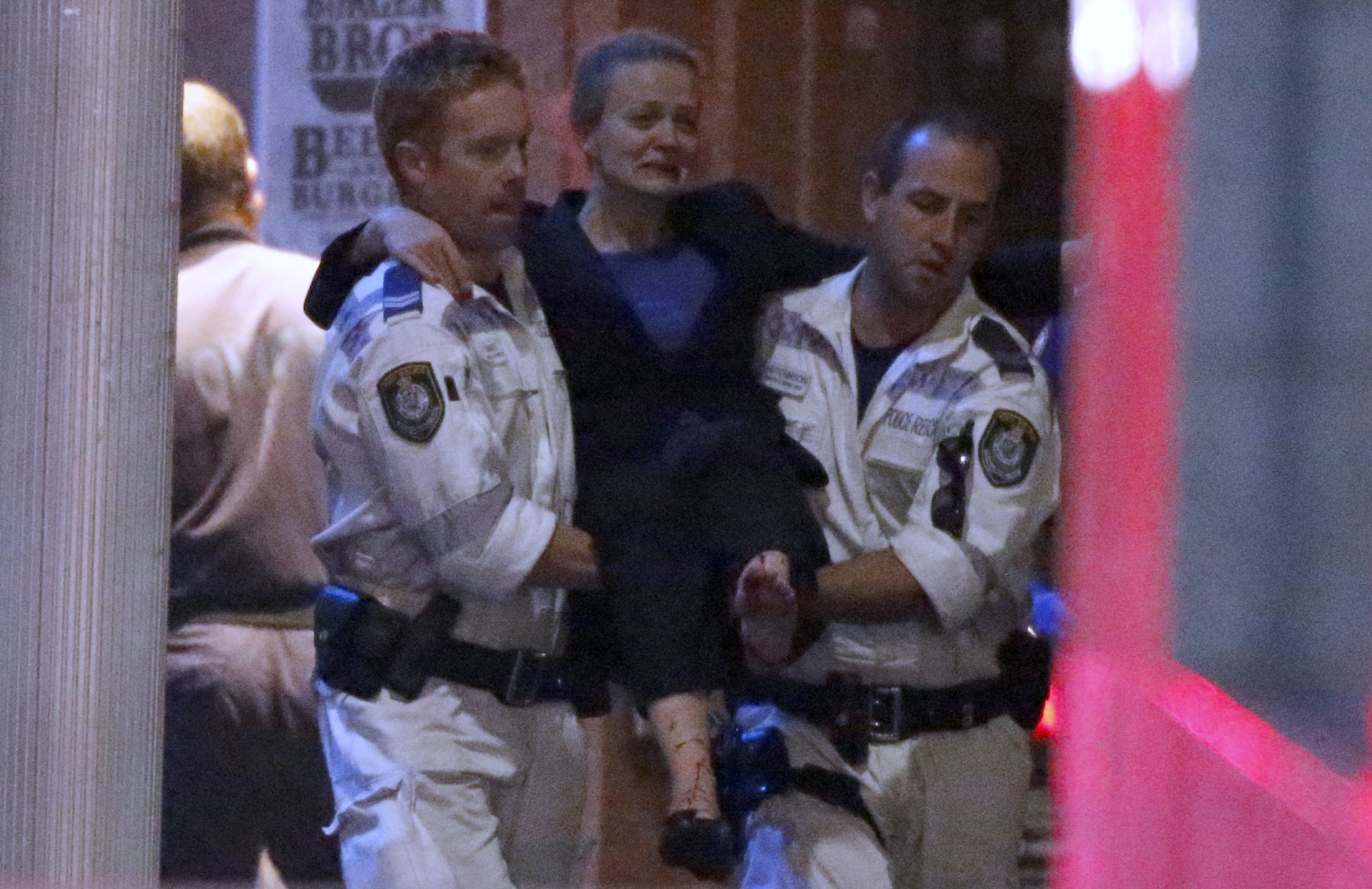 Police storm Sydney cafe to end hostage siege, three dead