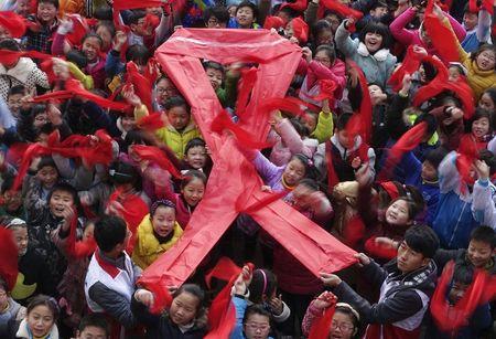 Chinese villagers seek to banish HIV-infected boy - state media