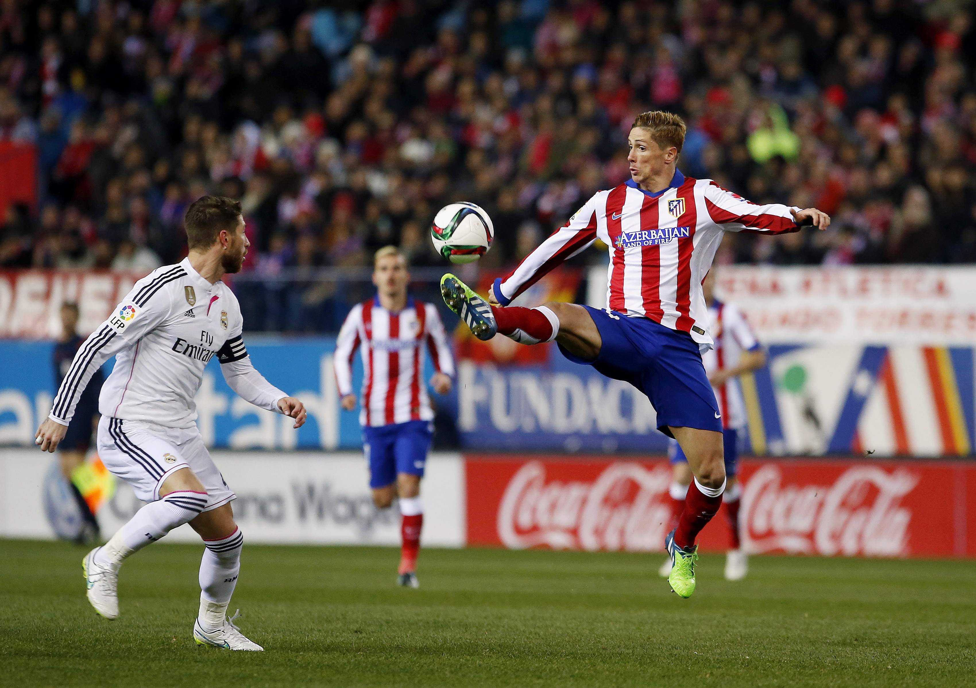 Torres subdued on return but Atletico sink Real