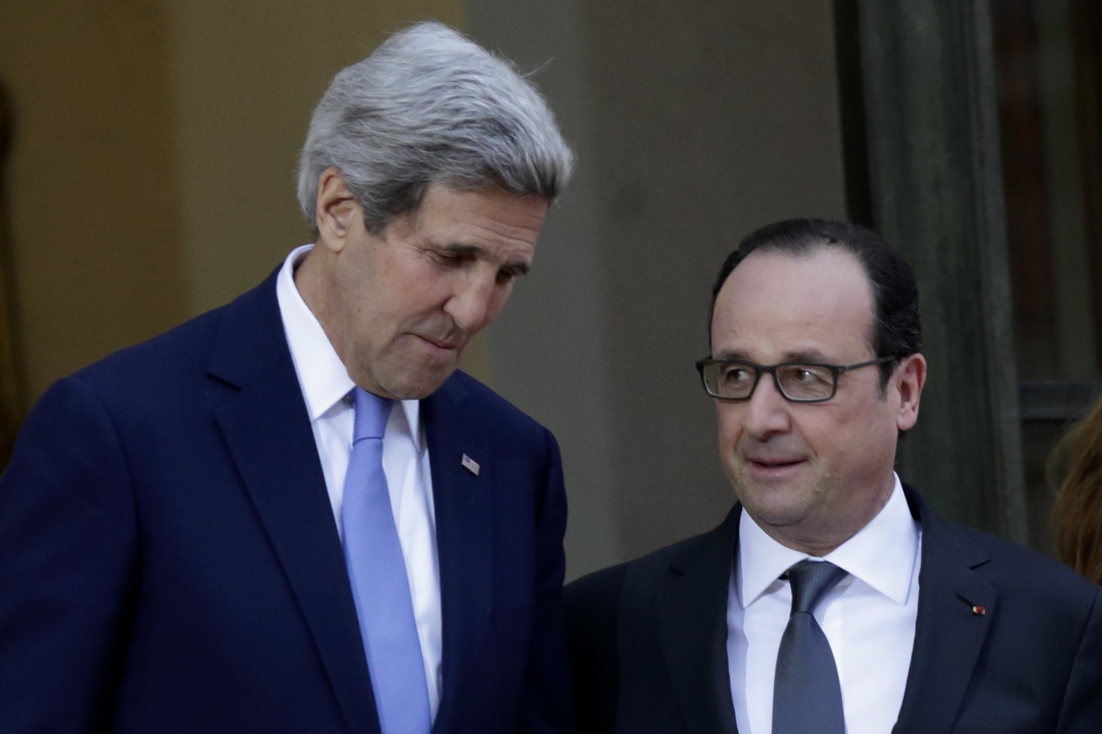 Paris police arrest 12 linked to shootings as US' Kerry arrives