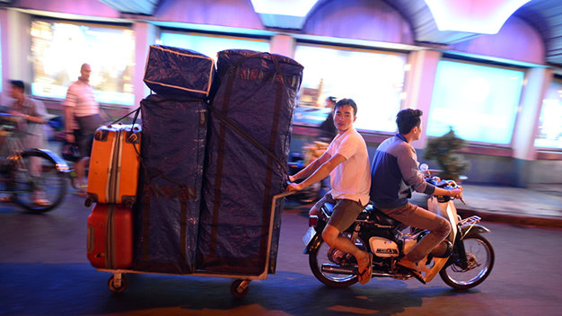 Stall owners and staffers defy traffic laws in pushing or pulling along bulky items and not wearing helmets to cut down preparation time.