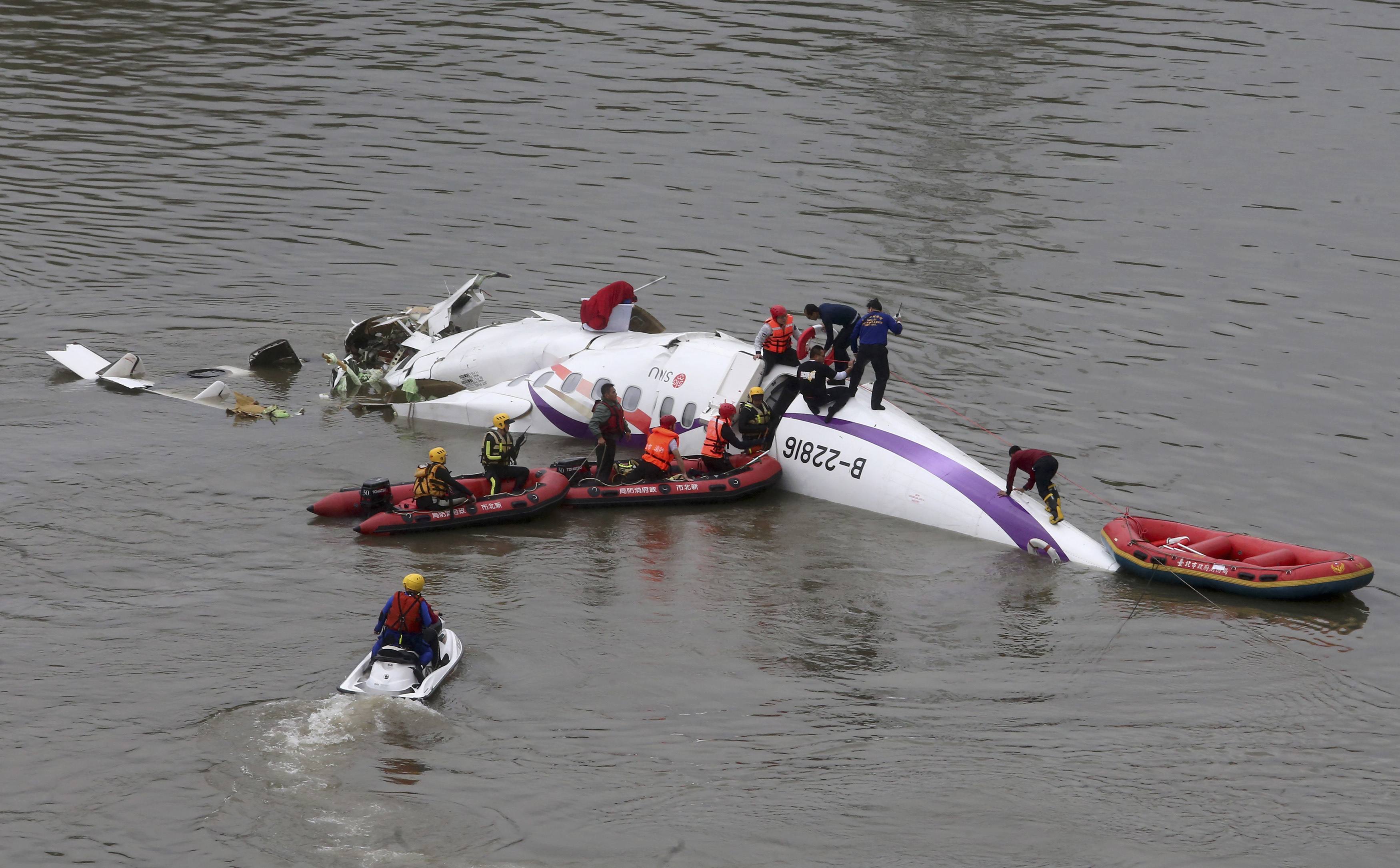 At least 11 dead as Taiwan plane cartwheels into river on take-off