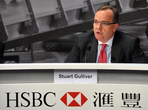HSBC boss defends Swiss account as bank profits slump