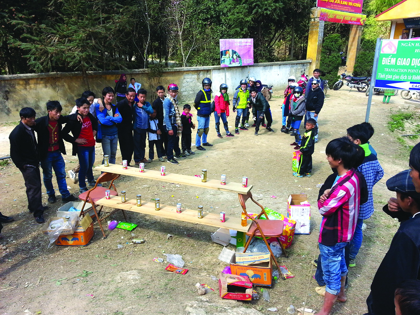 A group of backpackers from the capital city of Hanoi engage in a traditional activity with youngsters in Ha Giang Province.