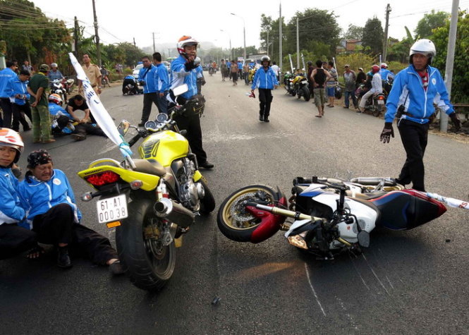 Police detain driver who ran over motorcycle escort during sport event in Vietnam