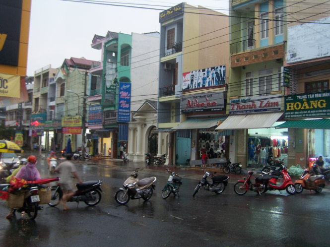 In Vietnam, residents barricade streets with bikes to protect houses from rainwater