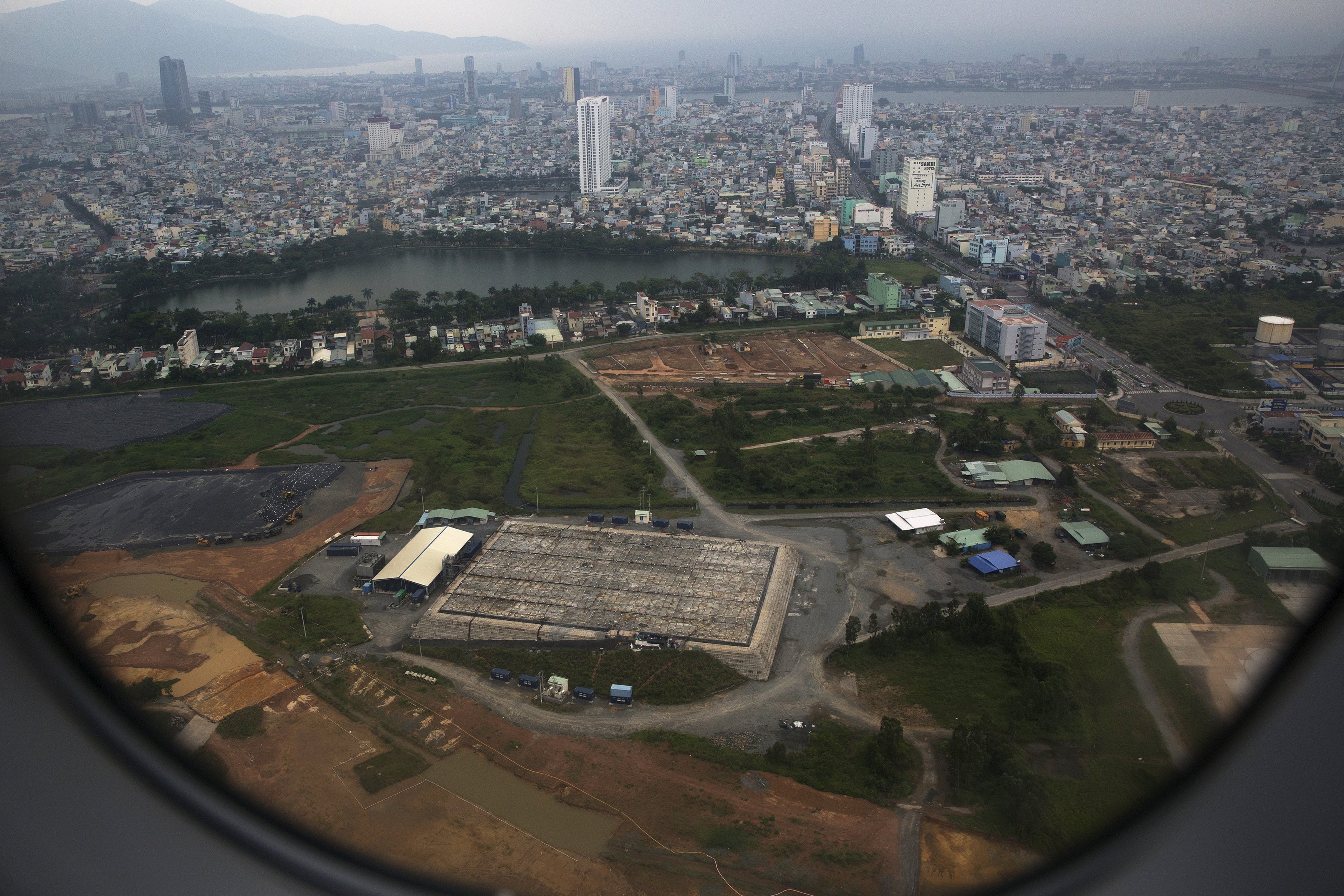 The cleaning operation of the area that was used for storing Agent Orange is seen from a plane taking off from Danang international airport April 13, 2015. Agent Orange was stored at Danang airbase and sprayed from U.S. warplanes to expose Vietnamese troops from the North and destroy their supplies, in jungles along the border with Laos. Since 2012, both the U.S. and Vietnam have been conducting a clean-up operation at the site.